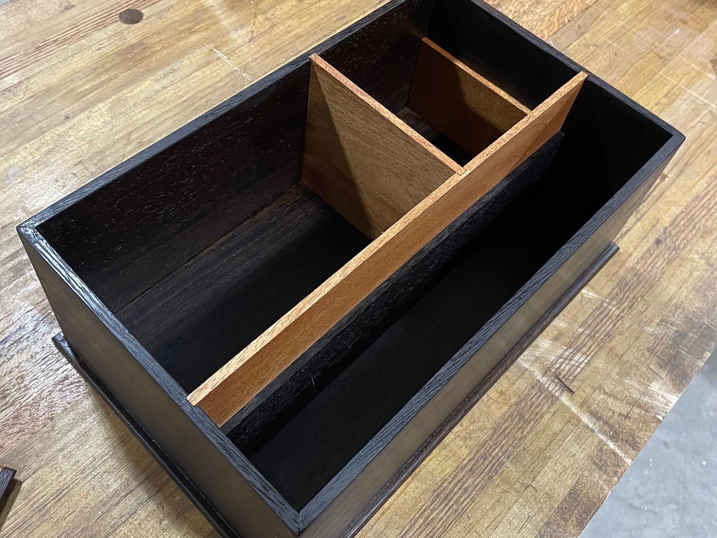 Wenge case with mahogany dividers forming golden-ratio pockets, before the sliding drawer is installed.