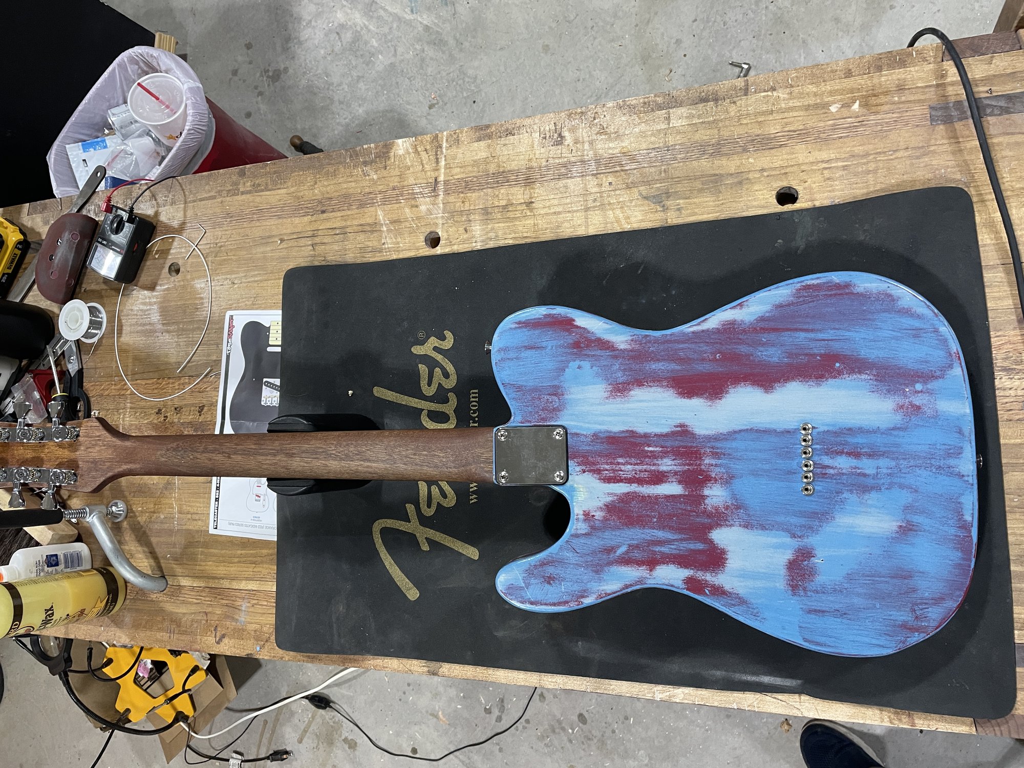 Back of The Mistake: the same blue and red pine body, four-bolt neck plate, no back routing visible.
